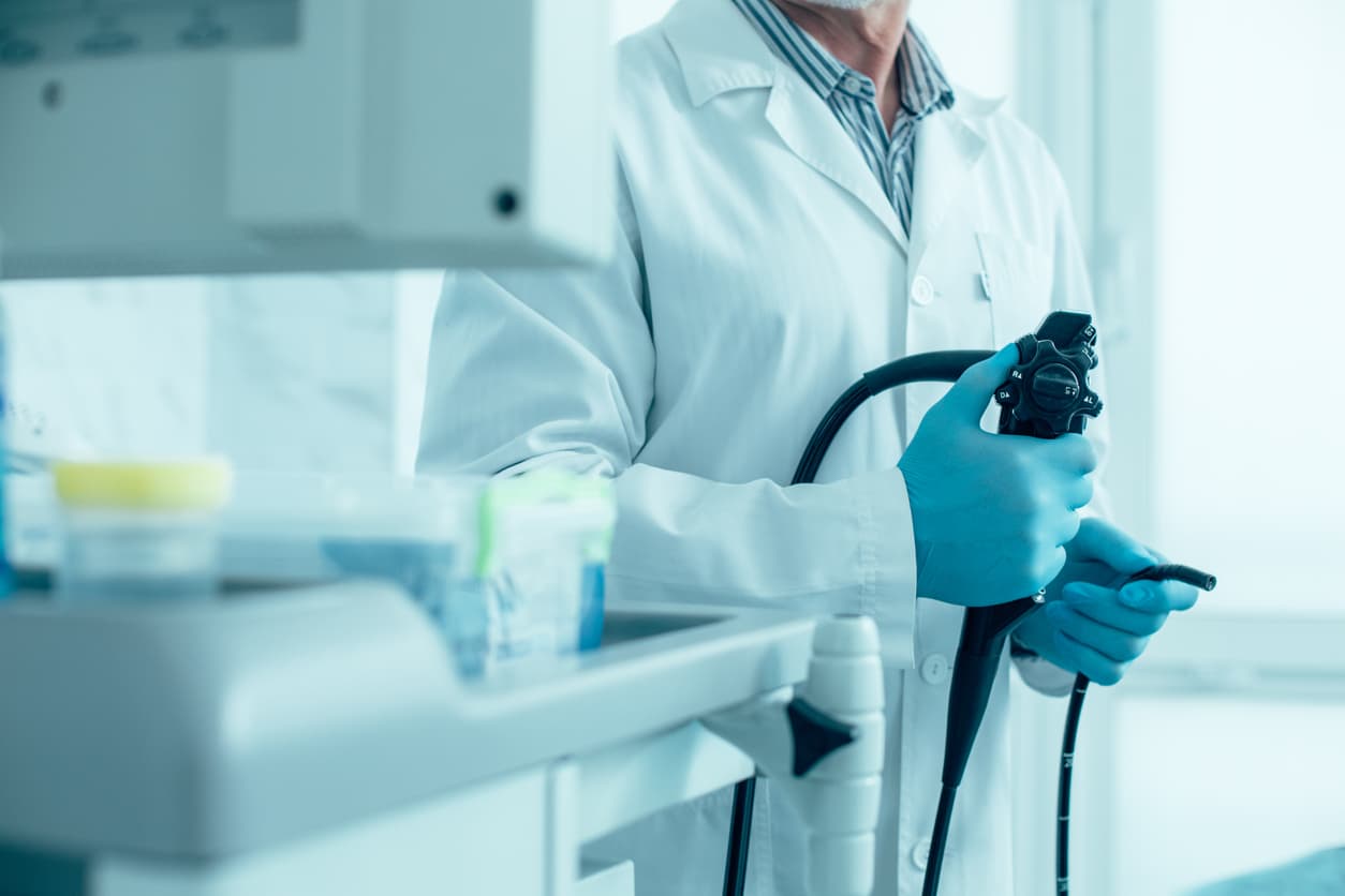 Modern endoscope in hands of experienced medical worker stock photo