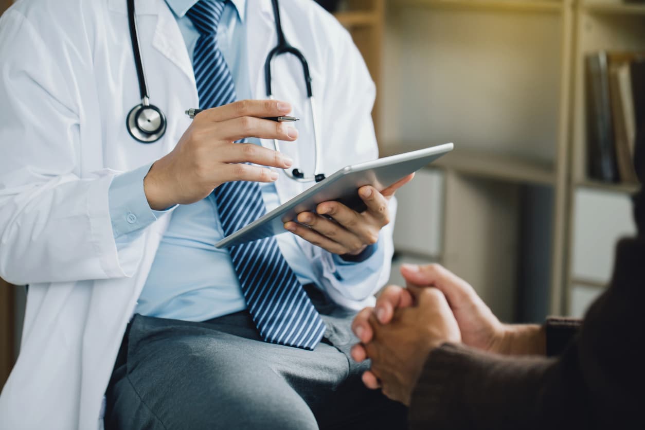 doctor consulting their patient stock image